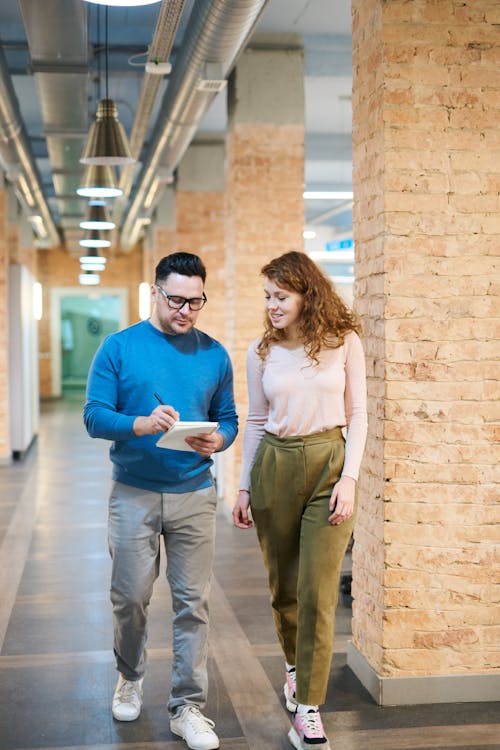 Photo Of People Walking On Hallway