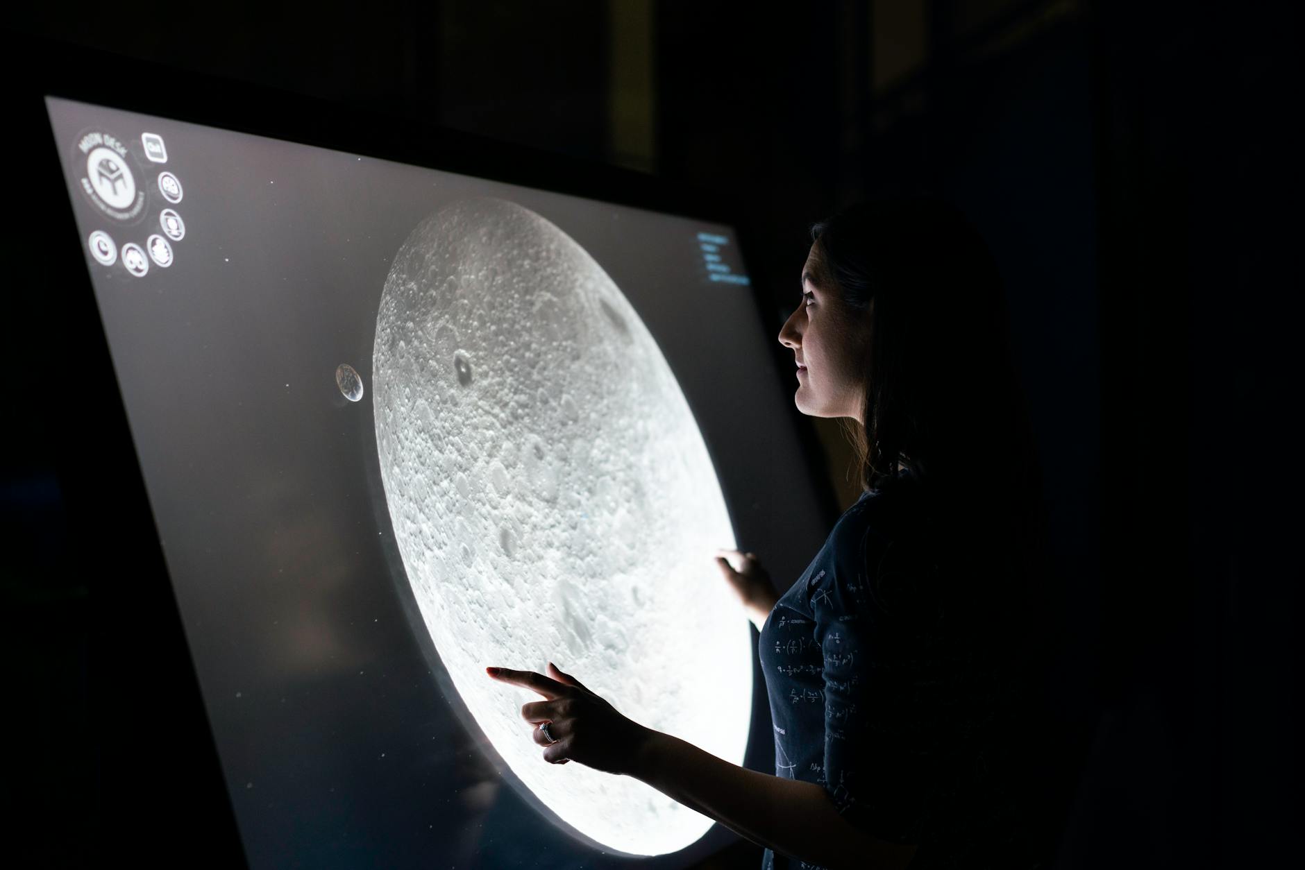 https://www.pexels.com/photo/woman-studying-moon-surface-3862606/